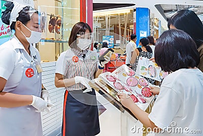 KANCHANABURI,THAILAND-JUNE 21,2020: Unidentified customers choose to order food from menu in front of the restaurant before into Editorial Stock Photo