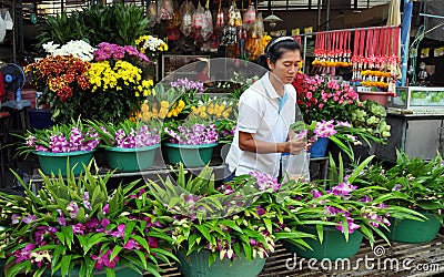 Kanchanaburi, Thailand: Woman Selling Orchids Editorial Stock Photo