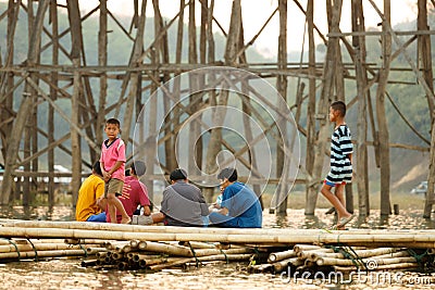 Sangklaburi or Myanmar tall wooden bridge on Songaria River Editorial Stock Photo