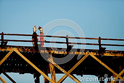 Sangklaburi or Myanmar tall wooden bridge on Songaria River Editorial Stock Photo