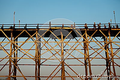 Sangklaburi or Myanmar tall wooden bridge on Songaria River Editorial Stock Photo