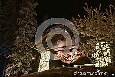 Kandahar lodge sign detail with Christmas lights an flocked trees Editorial Stock Photo