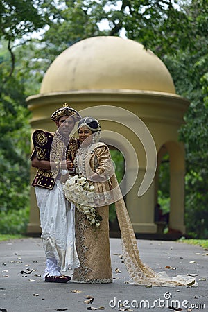 Kandy, Sri Lanka, November 10, 2015: Bride and groom wearing traditional dress Editorial Stock Photo