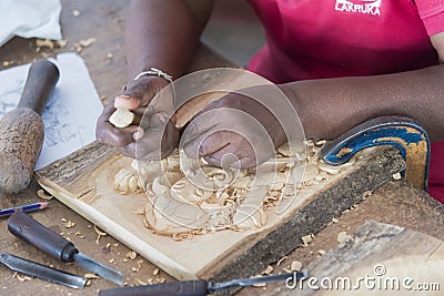 Kandy, Sri Lanka: 03/18/2019: Skilled wood carver hand crafting carvings for the tourist souvenirs Editorial Stock Photo