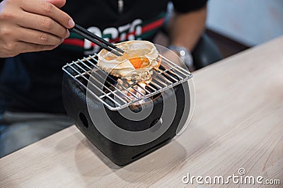 Kani miso grilling on japanese stove Stock Photo