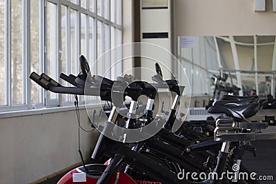 Kant, Kyrgyzstan- March 01 , 2019 : Row of training exercise bikes detail. Healthy lifestyle concept Editorial Stock Photo