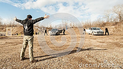 Kapap instructor Avi Nardia with students practice action gun shooting Editorial Stock Photo