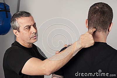 Kapap instructor shows the critical points. Pressure points fighting concept Stock Photo