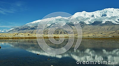 Karakul lake and Muztagh Ata Stock Photo