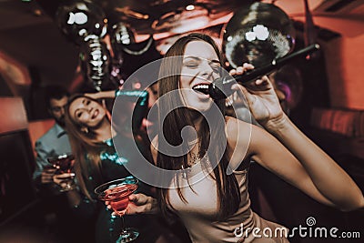 Karaoke Club. Sing and Drink. Beautiful Girls. Stock Photo