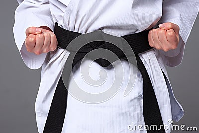 The karate girl with black belt Stock Photo