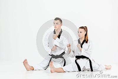 The karate girl and boy with black belts Stock Photo