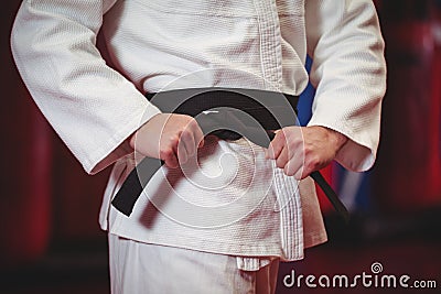 Karate player in black belt Stock Photo