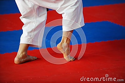 Karate practitioner on competition floor Stock Photo