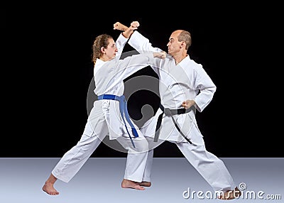 Karate technique is trained by adult athletes Stock Photo