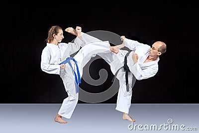 Karate technique is trained by adult athletes Stock Photo