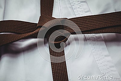 Karate uniform and brown belt Stock Photo