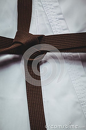 Karate uniform and brown belt Stock Photo