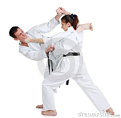 Karate. Young girl and a men in a kimono. Stock Photo