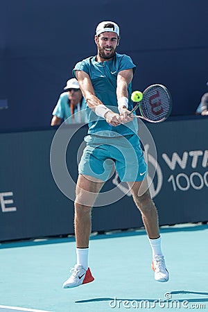 Karen Khachanov of Russia in action during quarter-final match against Francisco Cerundolo of Argentina at 2023 Miami Open Editorial Stock Photo