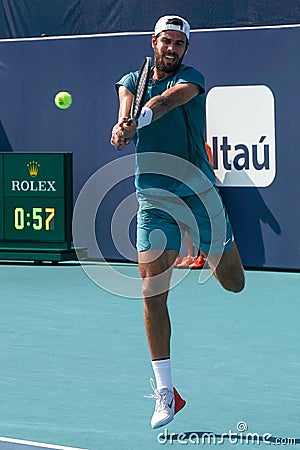 Karen Khachanov of Russia in action during quarter-final match against Francisco Cerundolo of Argentina at 2023 Miami Open Editorial Stock Photo