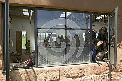 Karimba School with school children in classroom waving to camera in North Kenya, Africa Editorial Stock Photo