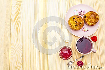 Karkade tea from hibiscus petals Sudanese rose. Gentle romantic breakfast concept. Buns, meringues, strawberry jelly. On a Stock Photo