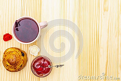 Karkade tea from hibiscus petals Sudanese rose. Gentle romantic breakfast concept. Buns, meringues, strawberry jelly. On a Stock Photo