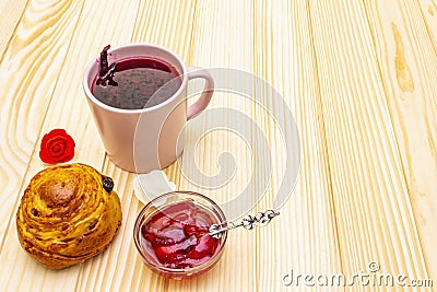 Karkade tea from hibiscus petals Sudanese rose. Gentle romantic breakfast concept. Buns, meringues, strawberry jelly. On a Stock Photo