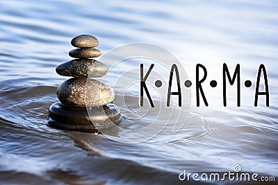 Karma concept. Stack of stones in sea water Stock Photo