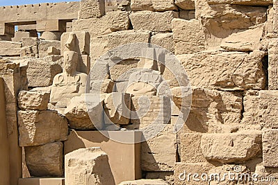 Karnak temple complex in Luxor, Egypt. Ruins of ancient temple with broken staues of pharaos Stock Photo