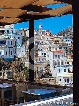 Karpathos, Greece: Scenic View of a Typical Old Village on a hill and small Restaurant Editorial Stock Photo