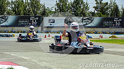 Kart racers rejoicing near the end of the competition Editorial Stock Photo