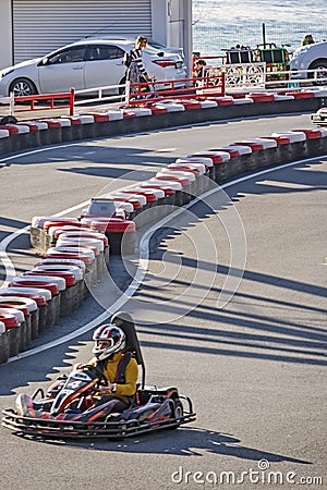 Kart racing or karting is a variant of motorsport road racing with open-wheel, four-wheeled Editorial Stock Photo