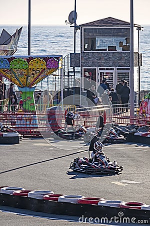 Kart racing or karting is a variant of motorsport road racing with open-wheel, four-wheeled Editorial Stock Photo