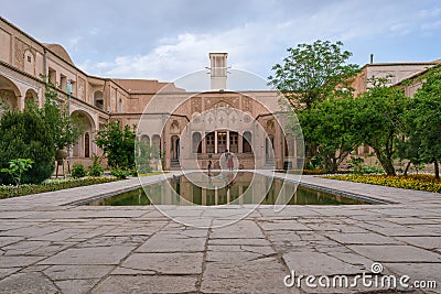 Kashan, Iran - 04.19.2019: Courtyard of richly decorated Borujerdi House, famous historical home from Qajar era. Pool Editorial Stock Photo