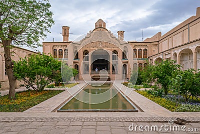 Kashan, Iran - 04.19.2019: Courtyard of richly decorated Borujerdi House, famous historical home from Qajar era. Pool Editorial Stock Photo