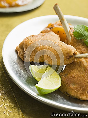 Kashmiri Lamb Cutlets with Lime Wedges Stock Photo