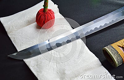 Katana Japanese sword blade and scabbard with red compress Stock Photo