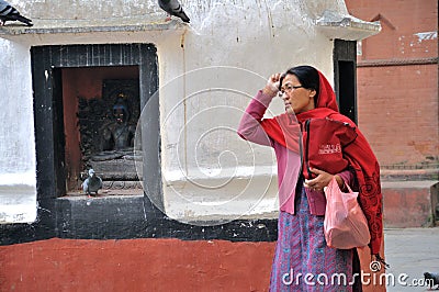 Praying at Kathesimbhu Stupa Editorial Stock Photo