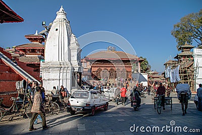Kathmandu, Nepal -December 28, 2011: People, bikes and cars on H Editorial Stock Photo