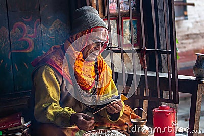 Hindu priest pray in Pashupatinath Editorial Stock Photo