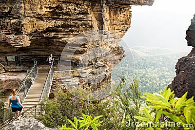 Bridge to rock formation Three Sisters with hikers looking into the valley, Katoomba, New South Wales, Australia Editorial Stock Photo