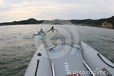 Japanese teenage boys on a dive adventure in Japan on an inflatable boat Editorial Stock Photo