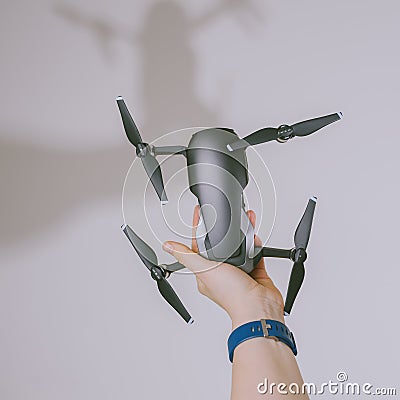 Holding DJI Mavic Air drone Editorial Stock Photo