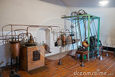 Kaunas, Lithuania - May 12, 2017: antique pharmaceutical tablet machine inside of Museum of History of Medicine and Pharmacy. Editorial Stock Photo