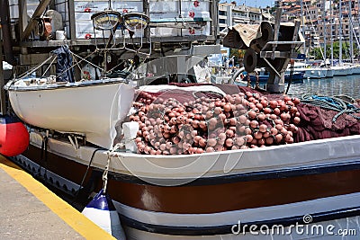KAVALA, GREECE- MAY 31, 2016: Fishing nets and buoys on board a fishing boat in the port of Kavala, Greece Editorial Stock Photo
