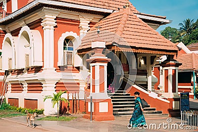 Kavlem, Phonda, Goa, India. Indian Woman Walking Near Shree Shantadurga Mandir, Kavlem Temple. Famous Landmark And Editorial Stock Photo