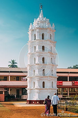 Kavlem, Phonda, Goa, India. People Walking Near Shree Shantadurga Mandir, Kavlem Temple. Famous Landmark And Popular Editorial Stock Photo