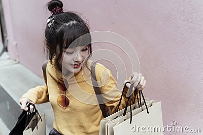 Kawaii shopping girl and her paper bags Stock Photo